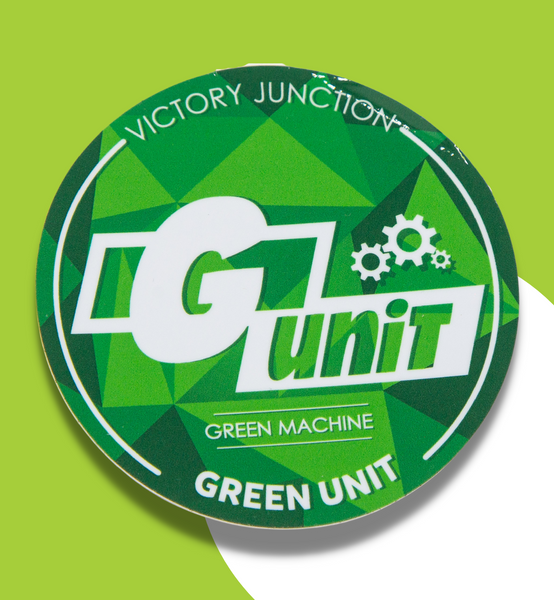 Green sticker that reads "Victory Junction" at the top. In the middle read "G Unit. Green machine." At the bottom reads "Green Unit". 