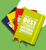 Green, red, yellow, and blue journals fanned out. The fronts read "The Best Stories are made at Victory Junction."